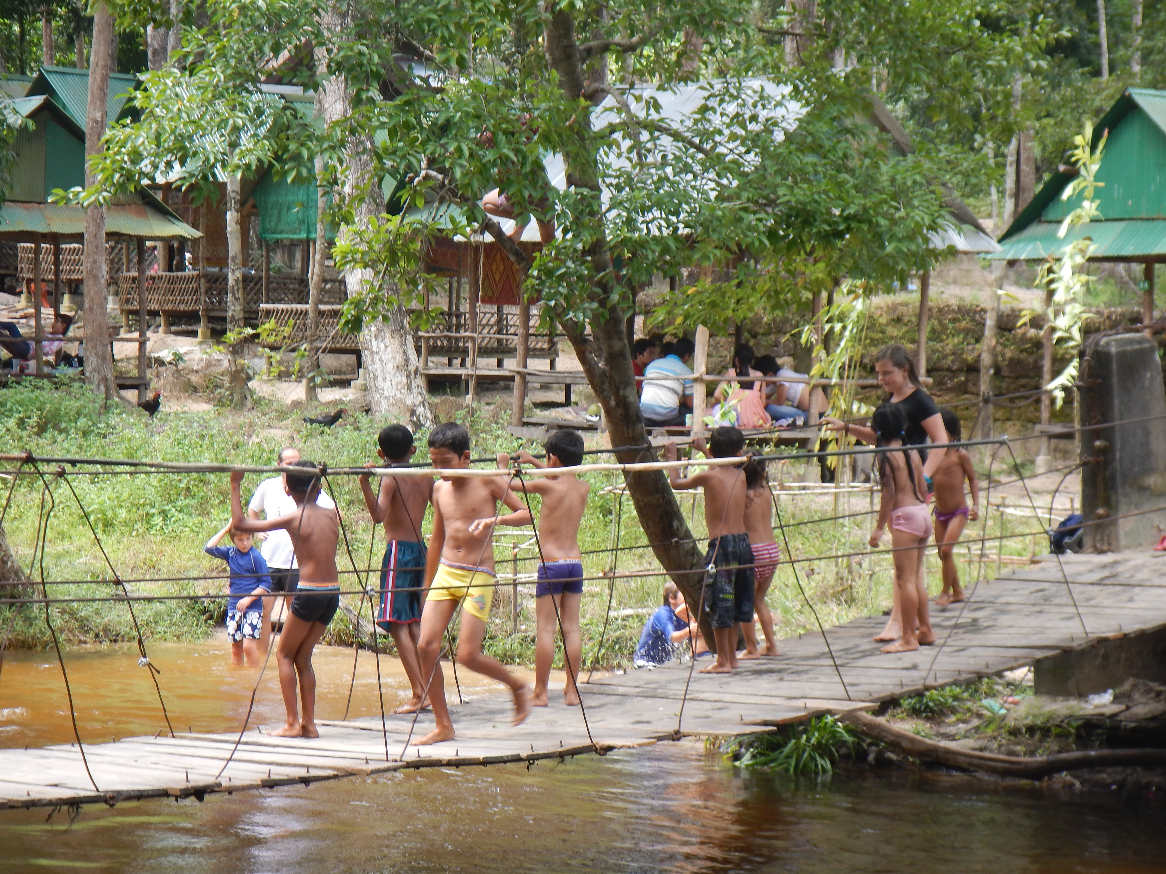 Local children swimming in the Kulen stream
